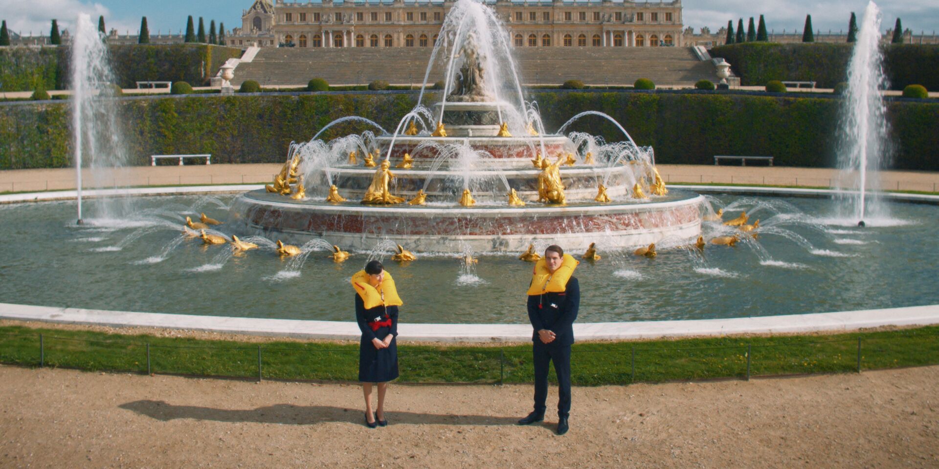 Crew in front of a fountain